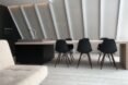 wood dining table connected to a sink