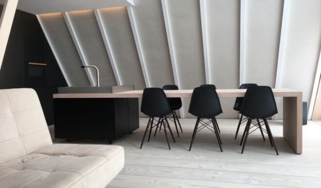 wood dining table connected to a sink