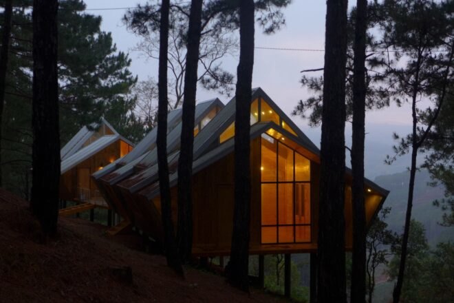 wood cabins with glass panels in the facade