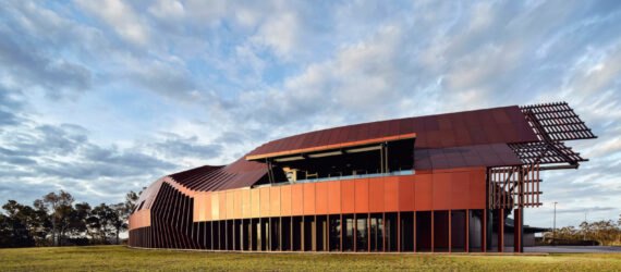 elongated modern building with reflective facade