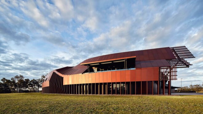elongated modern building with reflective facade