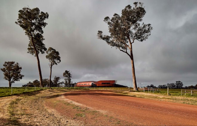 long red building on a farm