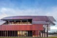 long building with red metal exterior