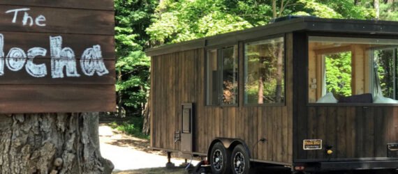 Wooden tiny home with large windows