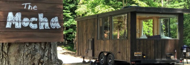 Wooden tiny home with large windows