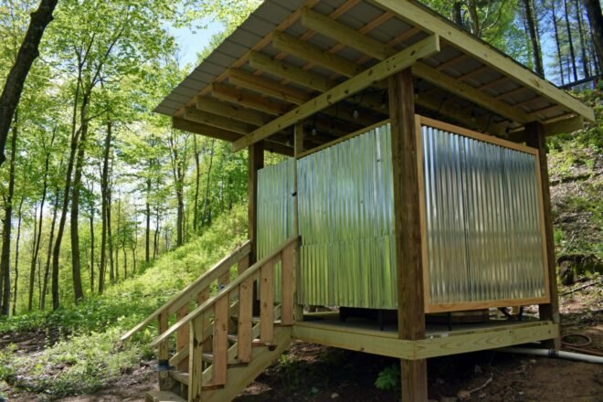 wooden structure with corrugated metal panelling