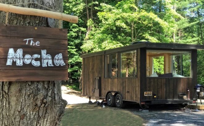 Wooden tiny home with large windows