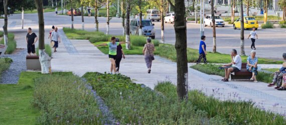 people walking down a walkway