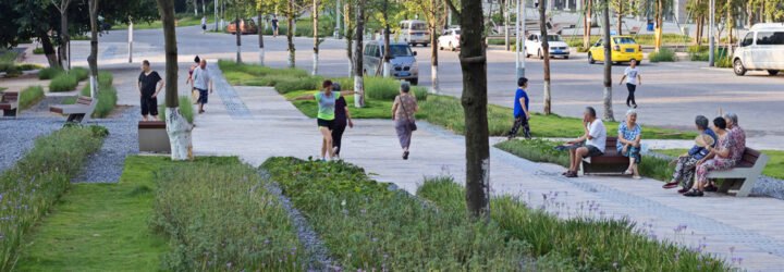 people walking down a walkway