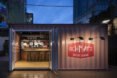 small gray shipping container with door open