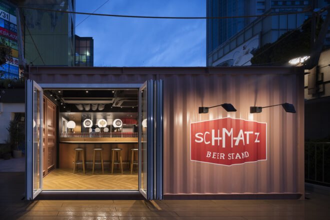 small gray shipping container with door open
