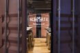 corrugated metal doors opening to a restaurant
