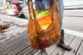 person holding old biodegradable plastic bag stuffed with groceries