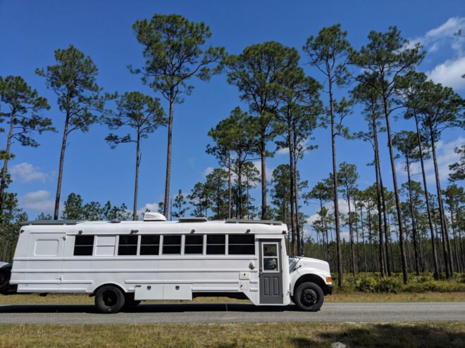 white bus parked on a street