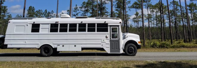 white bus parked on a street