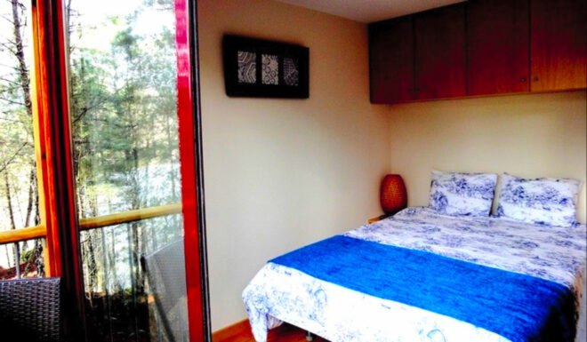bedroom with door leading to patio