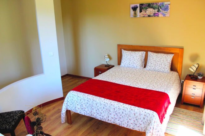 bedroom with white and red bed