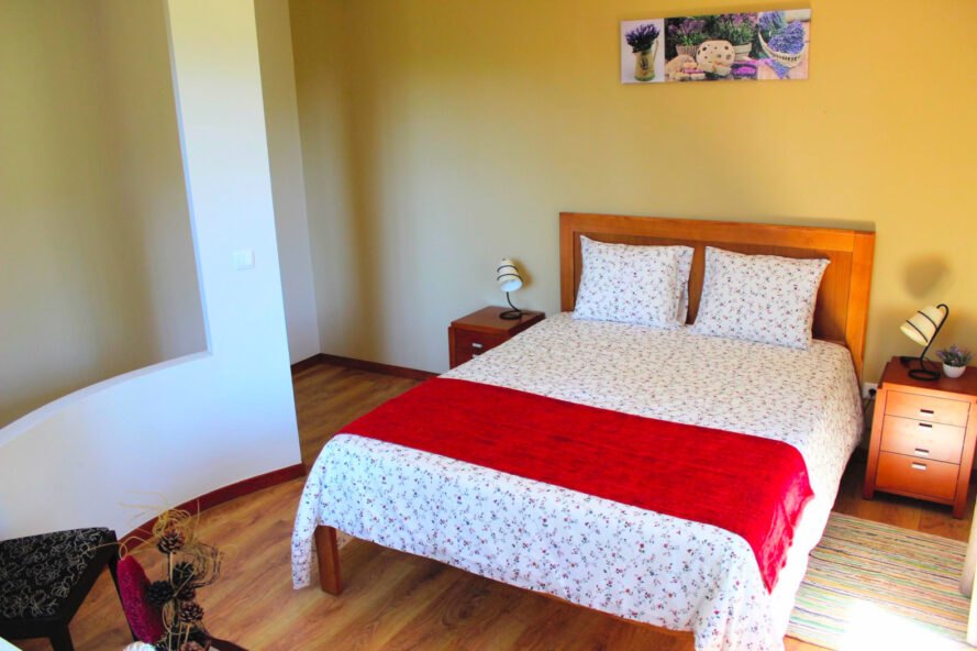 bedroom with white and red bed