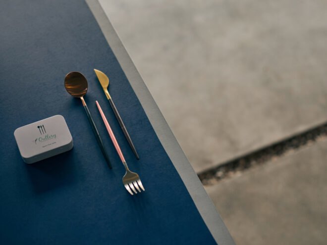 reusable cutlery beside small white box