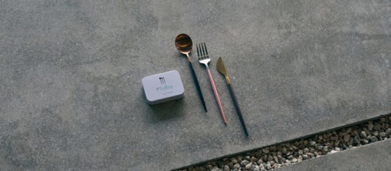 reusable cutlery beside small white box