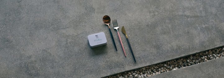 reusable cutlery beside small white box