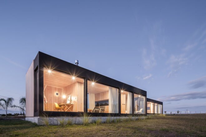 two rectangular structures lit up at night