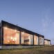 two rectangular structures lit up at night