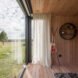 wood-lined interior with large glass window