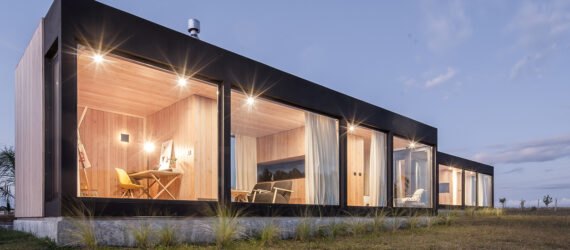 two rectangular structures lit up at night