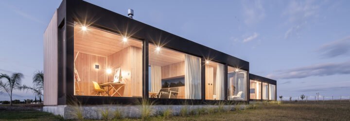 two rectangular structures lit up at night