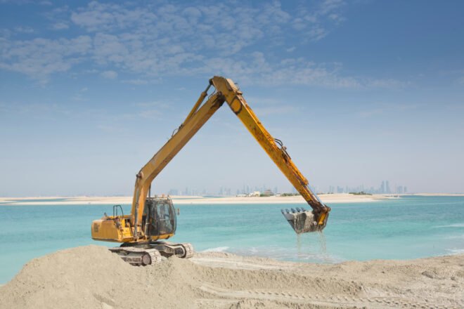 sand dredging takes place in order to build artificial island