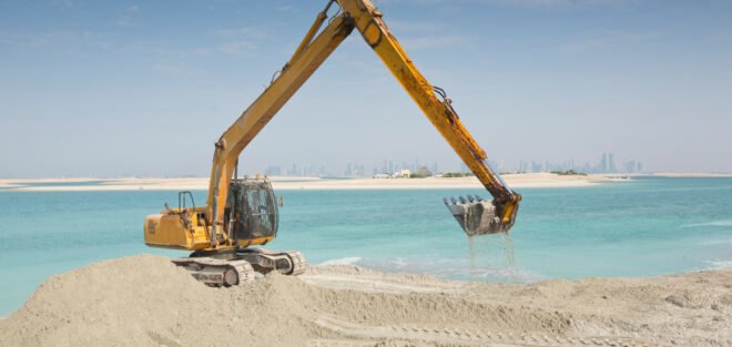 sand dredging takes place in order to build artificial island