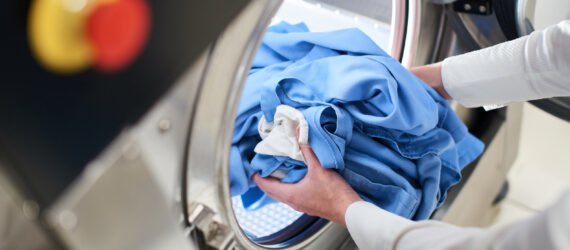 person using washing machine