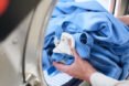 person using washing machine