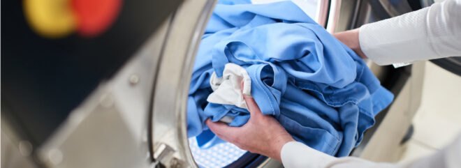 person using washing machine