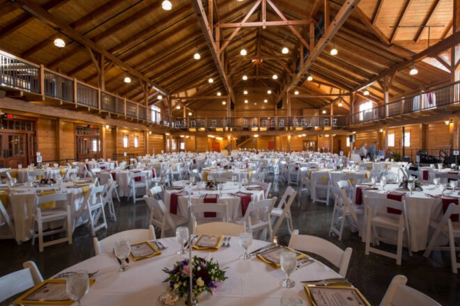 large dining hall with exposed timber beams in the ceiling