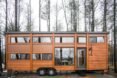 two-story tiny home with lots of windows