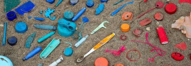 colorful pieces of plastic on a beach