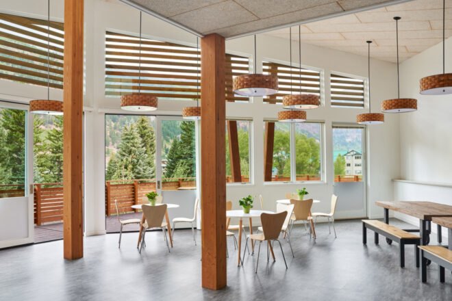 dining room with wood chairs and white tables