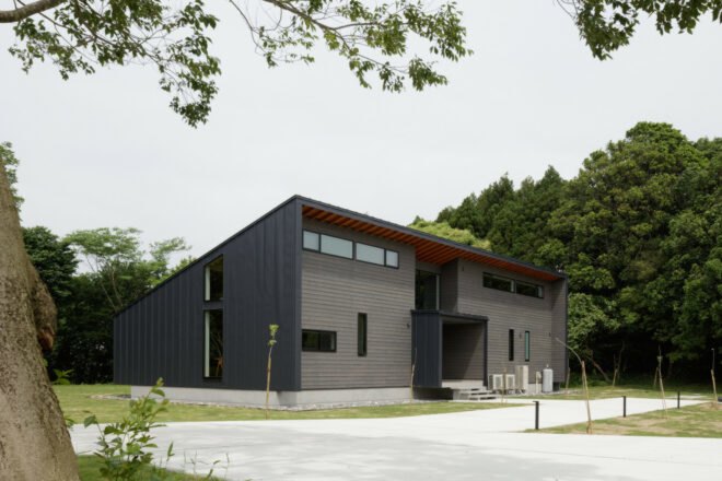 black timber home with mono-pitched roof