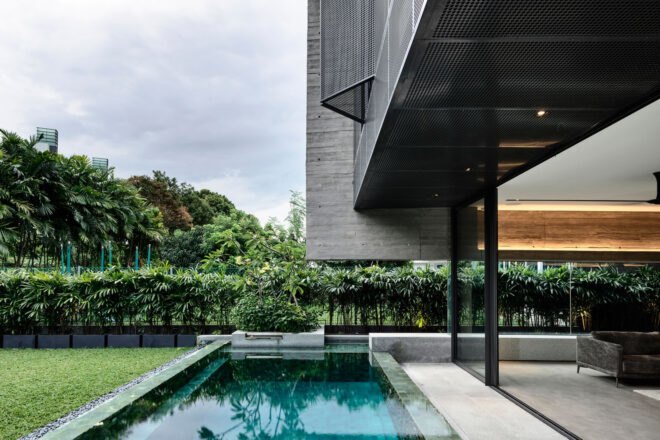 home besides a pool and greenery