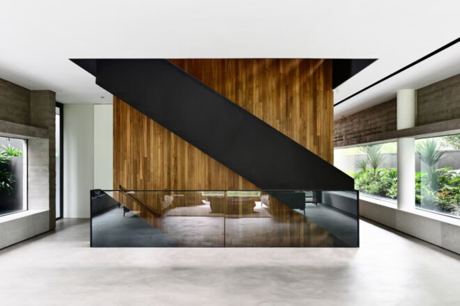 interior of home with steel staircase next to elevator