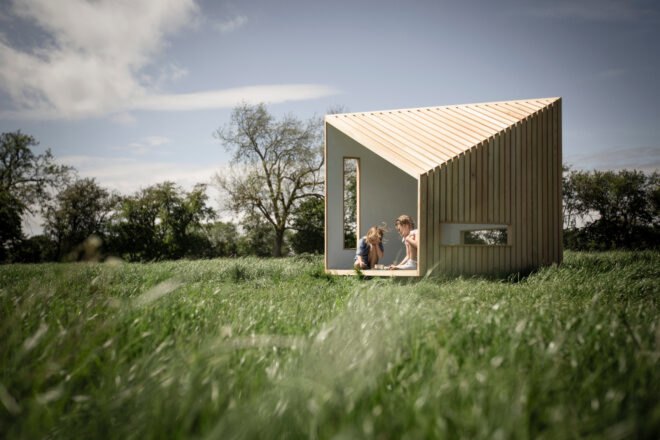 kids playing in wood playhouse