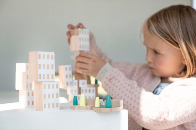 little girl playing with blocks