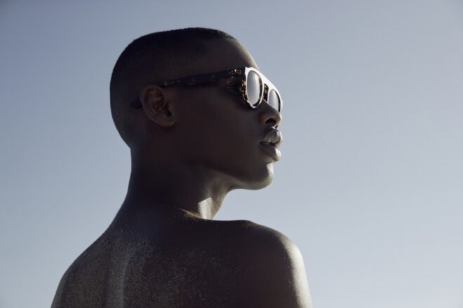 model wears brown sunglasses