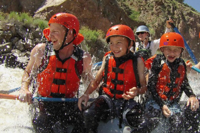 group of people river rafting