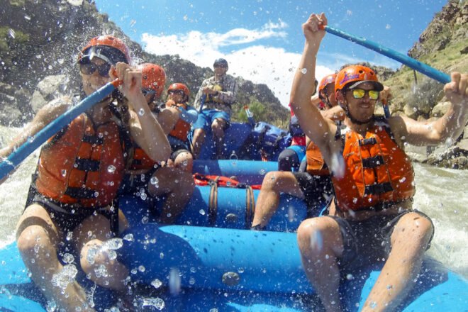 group of people river rafting