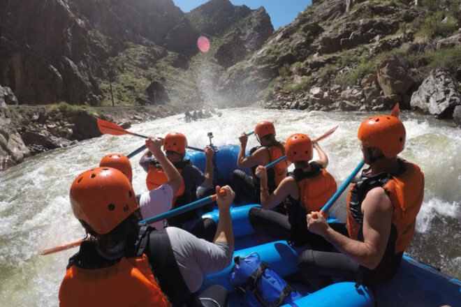 group of people river rafting