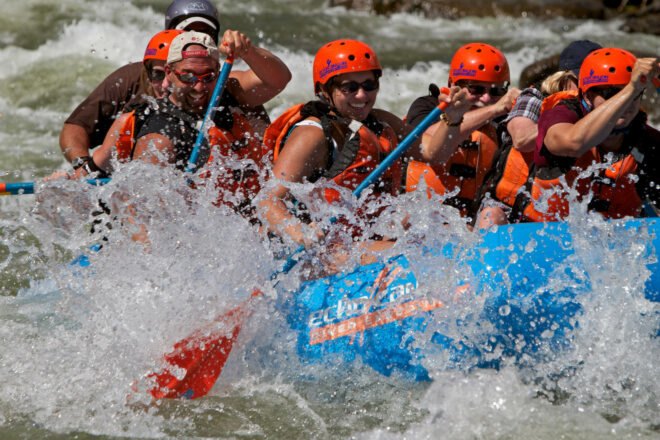 group of people river rafting