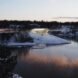 rendering of curving building atop icy hill